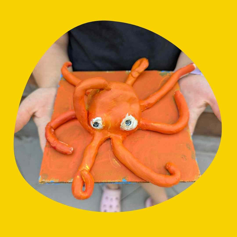 A clay octopus sculpture made by a young artist at a holiday workshop